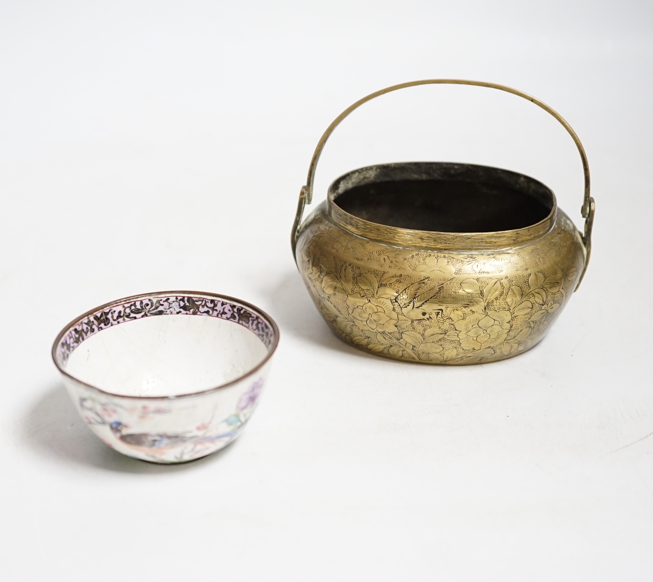 A Chinese bronze hand warmer, 11.3cm and an 18th century Chinese Canton enamel cup, cup 7cm diameter